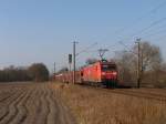 145 040-2 mit einem Güterzug zwischen Emden und Rheine bei Devermühlen (BÜ 296.6) am 23-3-2012.