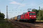Am 06.06.2014 fuhr DBSC 145 029-5 mit einem Containerzug durch den Bahnhof von Orschweier in Richtung Freiburg.