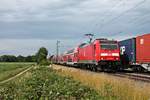 Als RB (Freiburg (Brsg) Hbf - Basel Bad Bf) fuhr am späten Nachmittag des 15.06.2020 die 146 228-2  St.Georgen  südlich von Buggingen über die KBS 702 (Rehintalbahn) in Richtung Müllheim (Baden), wo sie ihren nächsten Zwischenhalt einlegen wird.