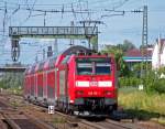 146 115 mit RE31014 in Orschweier, 19.7.09. Leider flimmert das Bild wegen der groen Hitze an dem Tag...