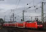 Die 146 010 mit der RE1 (10114) nach Aachen bei der Ausfahrt in Kln Messe/Deutz 27.12.09