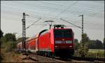 146 031 glnzt in der Mittagssonne des 27.09.2009 als sie den RE1 (RE 10121)  NRW-Express  nach Hamm(Westf) bespannte.