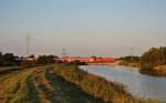 Eine 146 fuhr am 03.09.2014 mit einem RE von Norddeich Mole nach Hannover, hier beim Sauteler Kanal in Neermoor.