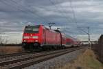 Am 06.01.2014 bespannte die Freiburger 146 228-2  St.Georgen  eine RegionalBahn nach Neuenburg (Baden), als sie kurz vor ihrem nächsten Halt in Müllheim (Baden) am Fotografen vorbei fuhr.