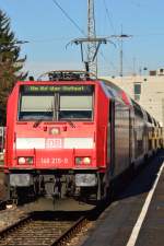 Am Vormittag des 17.2.2014 steht mit einer RB nach Ulm Hbf die 146 215-9 am Gleis 12 des Bahnhof Neckarelz im strahlenden Sonnenschein.