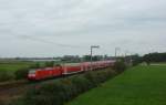 146 124-3 fuhr am 08.09.2012 mit einem RE von Norddeich Mole nach Hannover, hier bei Veenhusen.