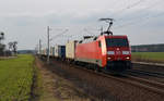 152 128 führte am 25.02.17 vor der aufziehenden Wolkenfront einen Containerzug durch Rodleben Richtung Roßlau.