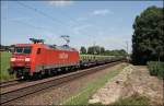 152 060 ist mit einem Stahlbrammenzug bei Vogl in Richtung Freilassing/Hammerau unterwegs. (10.07.2008)
