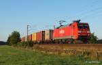 152 055-0 bringt im letzten Abendlicht des 1.08.12 einen vollen Containerzug von Hamburg durch Ramelsoh Richtung Buchholz.