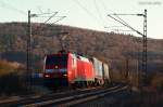 Im letzten Abendlicht fhrt 152 030-3 mit einem KLV-Zug durch das Sinntal Richtung Norden, hier bei Schaippach (02.03.2013)