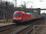 Mal wieder ein Taurus der DB im Gterzugdienst: 182 023-2 mit Containerzug in Fahrtrichtung Norden durch Eichenberg. Aufgenommen am 12.03.2011.