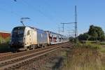 183 705 der Wiener Lokalbahnen mit Dacia Autozug am 30.09.2012 in Porz Wahn