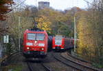 185 014-8 und 185 163-3  beide von DB und fahren durch Aachen-Schanz mit einem langen Ölzug aus Antwerpen-Petrol(B) nach Basel(CH) und kommen aus Richtung Aachen-West in Richtung Aachen-Hbf,Aachen-Rothe-Erde,Stolberg-Hbf(Rheinland)Eschweiler-Hbf,Langerwehe,Düren,Merzenich,Buir,Horrem,Kerpen-Köln-Ehrenfeld,Köln-West,Köln-Süd. Aufgenommen vom Bahnsteig von Aachen-Schanz.
Am Kalten Nachmittag vom 19.11.2017.