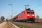 Mit einem gemischten Güterzug (Mannheim Rbf - Chiasso), der an diesem Tag hauptsächlich aus Autotransportwagen bestand, fuhr am 28.03.2017 die 185 104-7 nördlich von Müllheim (Baden) über die KBS 703 in Richtung Basel.