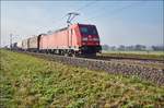 185 247-4 mit einen gemischten Güterzug bei Retzbach-Zellingen am 10.10.2018 in Richtung Norden unterwegs.