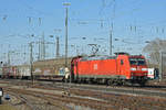 DB Lok 185 153-4 durchfährt den badischen Bahnhof. Die Aufnahme stammt vom 26.02.2019.