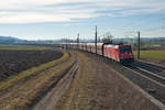 185 338 mit einem leeren Erzzug bei Oberhessbach Richtung Würzburg, 23.02.2019