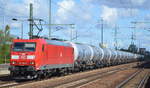 DB Cargo AG [D] mit  185 063-5  [NVR-Nummer: 91 80 6185 063-5 D-DB] und Kesselwagenzug am 19.09.19 Bahnhof Flughafen Berlin Schönefeld.
