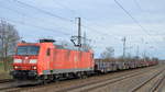 DB Cargo AG [D] mit  185 154-2  [NVR-Nummer: 91 80 6185 154-2 D-DB] und einem Ganzzug Drehgestell-Flachwagen mit Stahl-Brammen beladen am 18.12.19 Durchfahrt Bf.