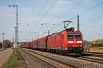 Am Nachmittag des 02.04.2019 fuhr 185 133-6 mit einem gemischten Güterzug (Mannheim Rbf - Chiasso Smistamento) durch die Gleisanlagen vom Bahnhof Müllheim (Baden) in Richtung Schweizer Grenze.