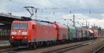 DB Cargo AG [D] mit  185 148-4  [NVR-Nummer: 91 80 6185 148-4 D-DB] und gemischten Güterwagen Richtung Ziltendorf EKO  am 16.03.21 Durchfahrt Bf.