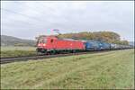 185 256-5 mit einen Aufliegerzug in Richtung Würzburg,Himmelstadt am 27.10.2021