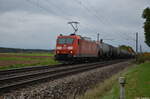 DB Cargo 185 049-4 zieht ihren Kesselwagenzug in Richtung Treuchtlingen. Die Lok könnte mal wieder eine Wäsche oder eine neue Lackierung gebrauchen. 14.10.2022 bei Gunzenhausen-Aha