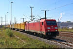 DHL-Express nach Großbeeren passiert mit 185 372-0 die Eisenbahnstraße von Halle-Ammendorf.
