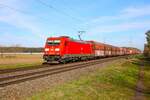 DB Cargo Bombardier Traxx 185 297-9 mit Kohlewagen bei Babenhausen auf der Rhein Main Bahn am 03.03.24