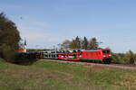 185 219 mit einem Autozug am 6. April 2024 bei Fahlenbach.