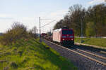 185 126 DB Cargo mit einem gemischten G�terzug bei Oberdachstetten Richtung Ansbach, 28.04.2022