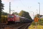 185 274-8 von Railion kommt  mit einem sehr langen Autozug aus Richtung Neuss und fhrt durch Kohlscheid in Richtung Aachen-West bei schnem Sonnenschein.
17.7.2011