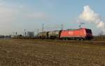 185 249-0 ist mit einem gemischten Gterzug am 20.02.2012 bei Waghusel