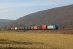 Die DB Schenker Mietlok 185 516 mit einem Stahlzug am 17.03.2012 bei Wernfeld.