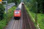 185 232-6 von Railion kommt mit einem Kesselzug aus Richtung Koblenz und fhrt in Richtung Kln Aufgenommen in Bad-Honnef am Rhein bei Regenwolken am 16.7.2012.