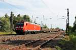Durchfahrt am 06.06.2014 von DBSC 185 030-4 mit einem gemischten Güterzug in Orschweier gen Offenburg.