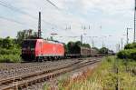 Durchfahrt am 14.06.2014 von 185 122-9 mit einem gemischten Güterzug in Müllheim (Baden) gen Norden.