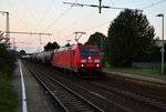 Mit einem Mischer am Haken ist die 185 278-9 bei der Durchfahrt in Rheydt Hbf, gleich biegt sie in den Odenkirchener Abzweig ab und fährt in Richtung Köln weiter.