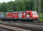 185 142-7 in Kln-Gremberg unterwegs mit einer netten Schweiz-Werbung. Aufgenommen am 20/06/2009.