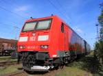 185 012-2+RBH 110(143 084-2)+RBH 101(143 874-6) warten in Hhe Haltepunkt Rostock-Dierkow auf den nchsten Einsatz.(01.05.2011)