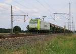 Captrain 185-CL 005 mit Schotter in ITL-Selbstentladewagen in Fahrtrichtung Wunstorf. Aufgenommen in Dedensen-Gümmer am 24.07.2015.