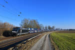 185 563 mit einem Autozug am 25.02.2018 bei Langenisarhofen.