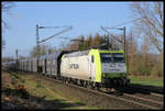 Captrain 185549-3 ist hier am 19.3.2019 um 8.51 Uhr mit einem Kohlependel bei Hasbergen in Richtung Bremen unterwegs.