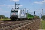185 540-2  Kassel Huskies  TX Logistik AG im Dienst für Raildox GmbH & Co. KG mit einem Holzzug in Friesack(Mark) in Richtung Neustadt(Dosse) unterwegs. 25.05.2011