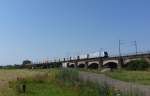 Eine 185 von Railpool fuhr am 25.07.2012 mit einem Containerzug ber die verdener Allerbrcke.