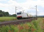 185 636-8 mit Silowagen-Ganzzug in Fahrtrichtung Norden. Aufgenommen am 10.07.2012 bei Harrbach.