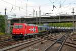 HGK 185 605-3 & Class 66 mit Kesselzug in Hamburg Harburg, Mai 2014.