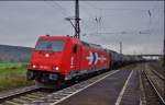 185 606-1 -HGK- ist am 11.11.14 mit einen Kesselzug in Richtung Süden bei Retzbach-Zellingen unterwegs.