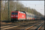 Railion 185191-4 kommt hier am 1.4.2007 um 8.23 Uhr mit einem Ganzzug in Richtung Münster durch den Bahnhof Natrup Hagen.