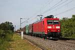 Mit einem langen gemischten Güterzug (Mannheim Rbf - Chiasso Smistamento) fuhr am Nachmittag des 24.05.2019 die 185 097-3 südlich vom Haltepunkt Buggingen über diue Rheintalbahn in